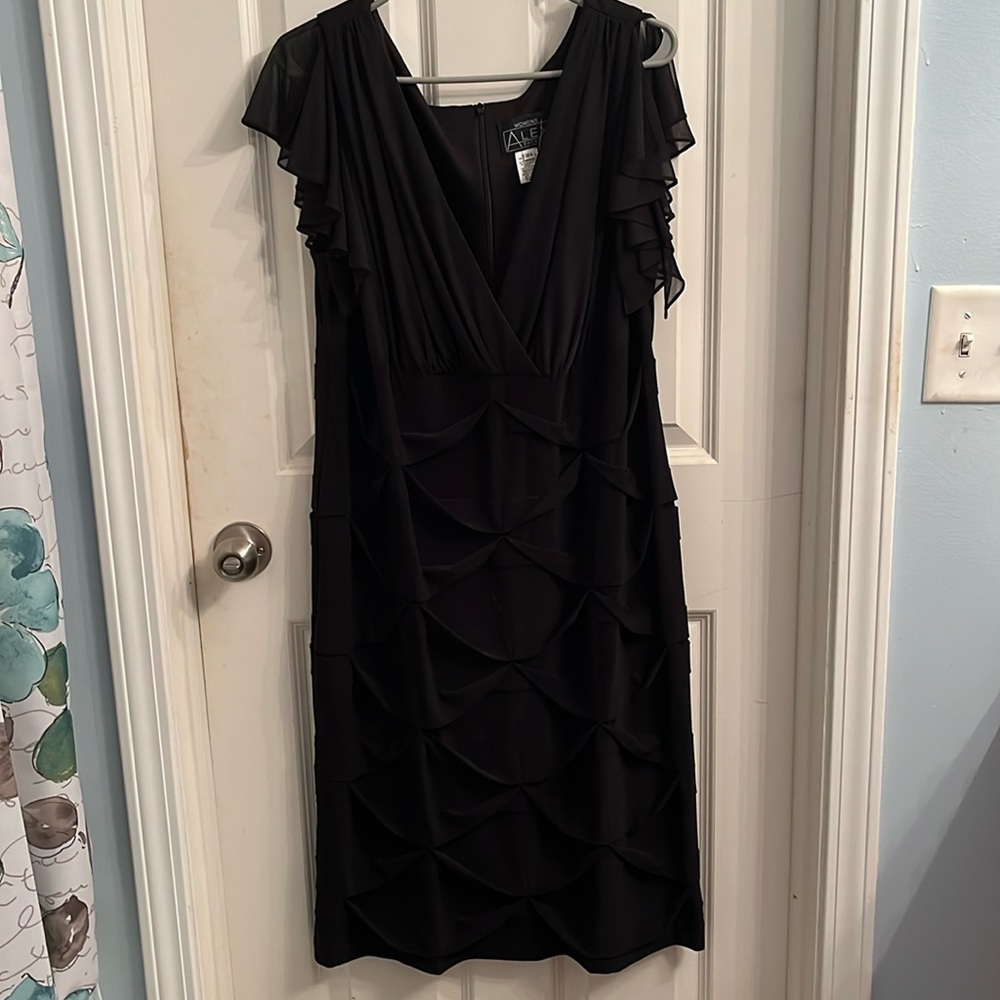 Black low cut V-neck dress, see through short sleeves, gorg crisscross bottom